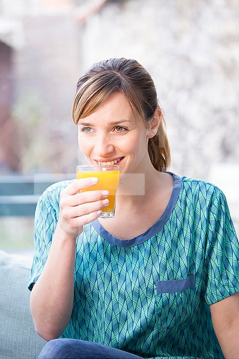 Woman drinking fresh fruit juice.
