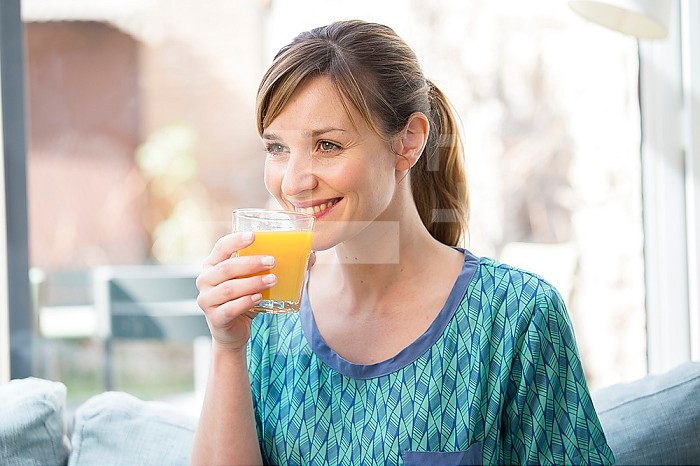 Woman drinking fresh fruit juice.