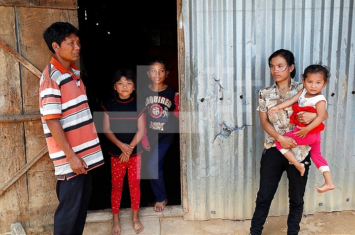 Poor vietnamese family living in a small barrack consists of scrap metal. Dalat. Vietnam.