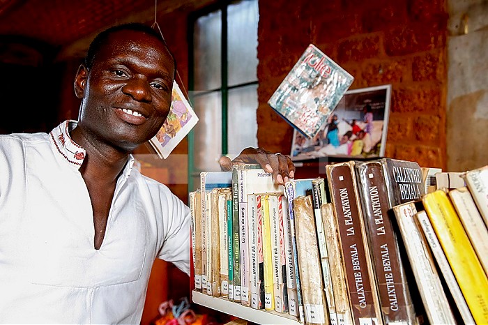 ICCV Nazemse NGO director Simon Nacoulma in the library, Ouagadougou, Burkina Faso.