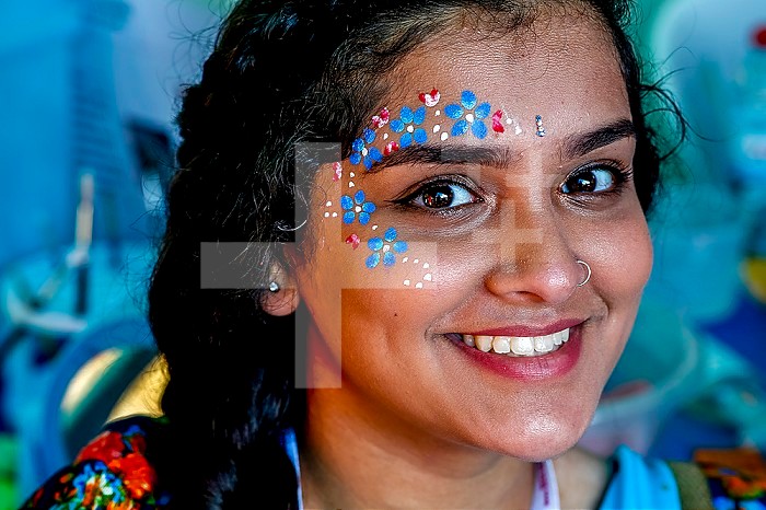 Young woman wearing gopi dots at Janmashtami hindu festival, Watford, U.K.