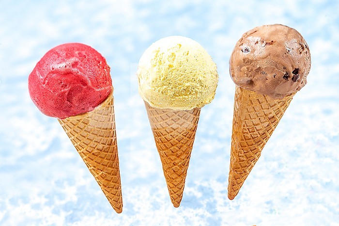 Chocolate, vanilla and strawberry ice cream in cones