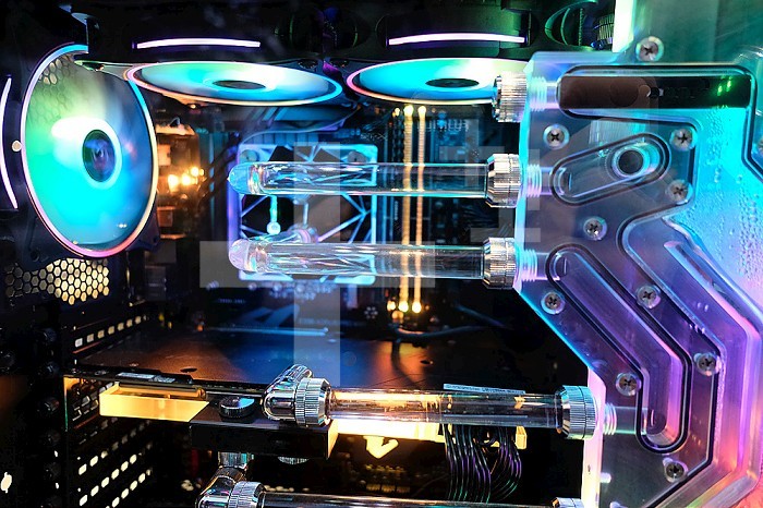 Gaming computer with liquid cooling, water and computer fan light.