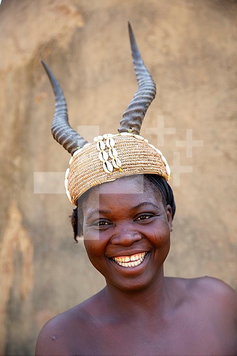 Batammariba woman with headgear in a Koutammakou village in North Togo.