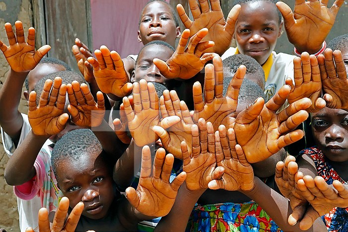 African village. Group of children showing their hands. Datcha-Attikpaye. Togo.
