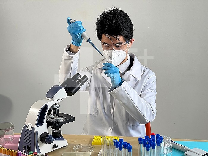 Laboratory technician carrying out experiments on different types of viruses and bacteria.