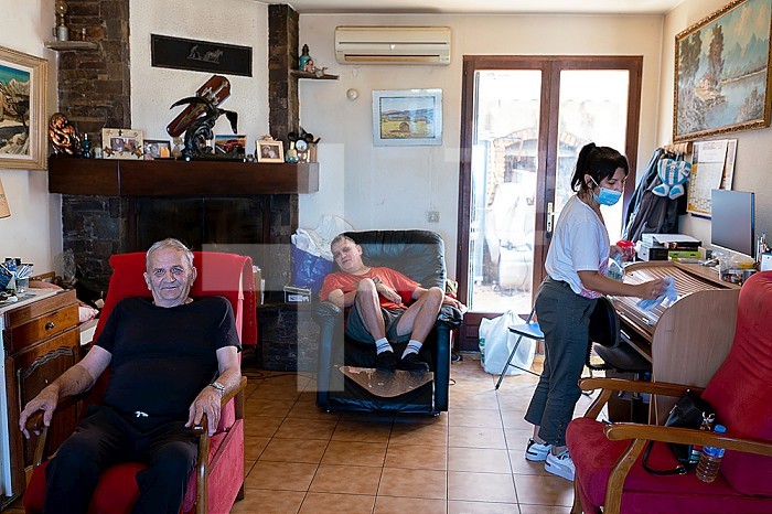 The daily life of a caregiver for a 60-year-old and his 55-year-old disabled son. This widower resumed smoking 2 years ago, after his wife who suffered from Alzheimer´s died of cancer. Despite 2 heart attacks, he has trouble quitting smoking. Port-Vendres, OCCITANIA, FRANCE.