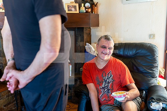The daily life of a caregiver for a 60-year-old and his 55-year-old disabled son. This widower resumed smoking 2 years ago, after his wife who suffered from Alzheimer´s died of cancer. Despite 2 heart attacks, he has trouble quitting smoking. Port-Vendres, OCCITANIA, FRANCE.