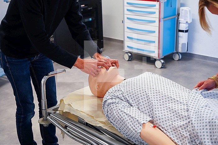 Resuscitation training on a dummy. Various health professionals are trained in the evolution of practices, care and emergency procedures within the Faculty of Medicine of Montpellier. They must work on serious cases of daily life faithfully reproduced on a SimMan dummy. Here, respiratory arrest on a man in his forties.