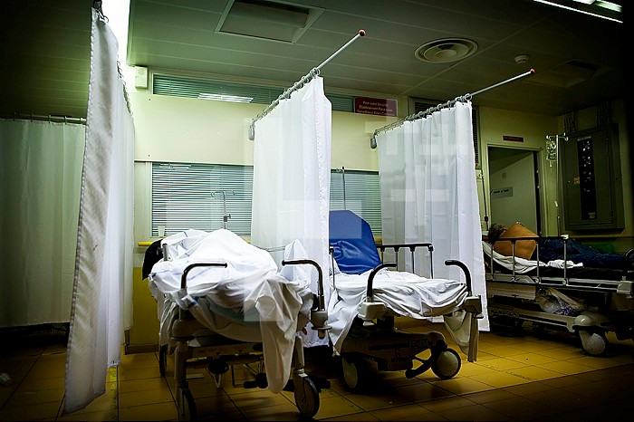 Patients in boxes in the night emergency in a hospital center in France.
