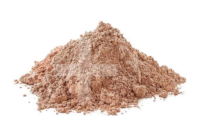 Heap of fine brown clay on white background.