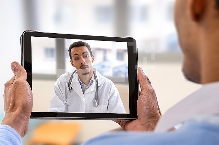 Patient in teleconsultation from his touch pad.