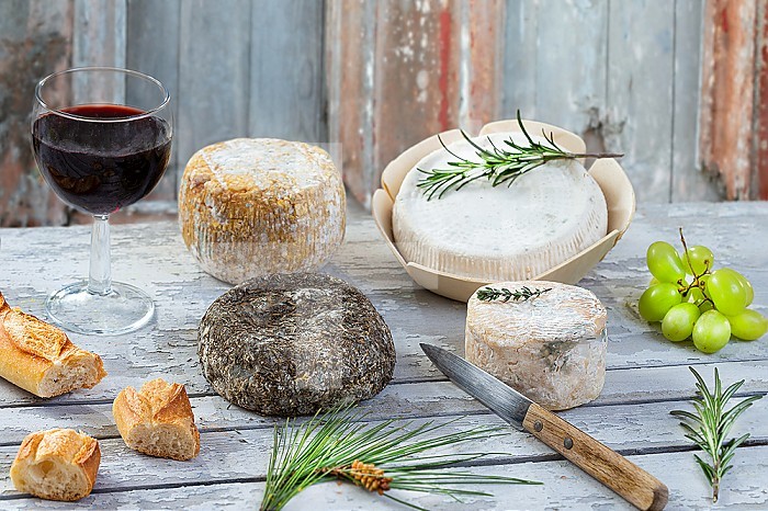Assortment of Corsican cheeses and red wine.