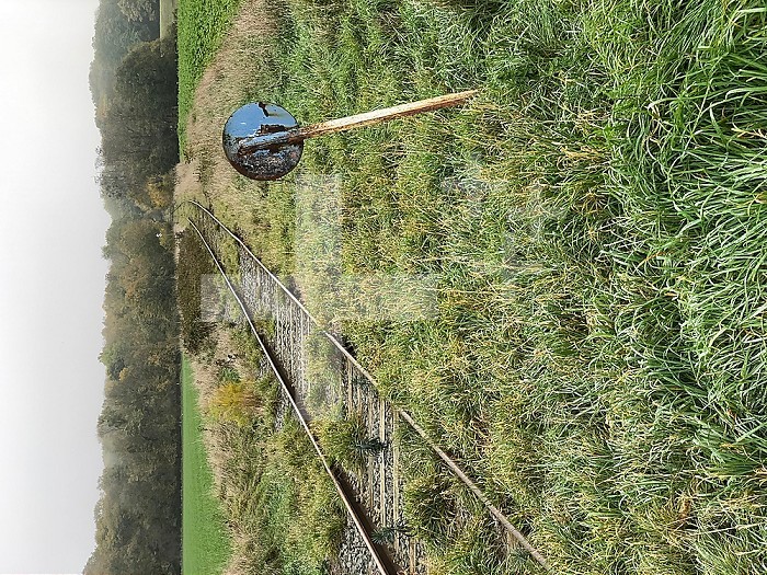 Railway track crossing a rural road in Hauts-de-France