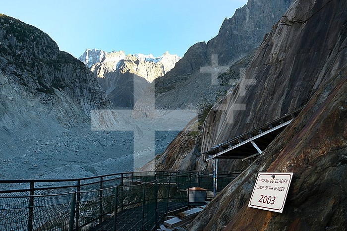 Montenvers - Mer de Glace - Chamonix, September 2022 Development (cable car/staircase) made to access the Mer de Glace cave and the mountaineering courses of the Mont-Blanc massif. Along the access road to the sea of ice, panels indicate the level of the ice according to the years. They show the significant melting of the glacier The Grotte de la Mer de Glace is fitted out each year to welcome the public