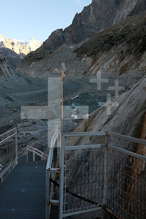 Montenvers - Mer de Glace - Chamonix, September 2022 Development (cable car/staircase) made to access the Mer de Glace cave and the mountaineering courses of the Mont-Blanc massif. Along the access road to the sea of ice, panels indicate the level of the ice according to the years. They show the significant melting of the glacier The Grotte de la Mer de Glace is fitted out each year to welcome the public