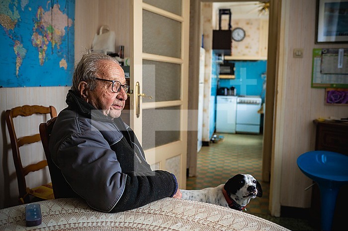 Loneliness of a 90-year-old senior living at home with his dog.