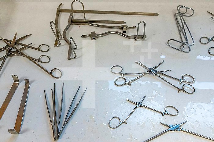 Surgical instruments in tray in washing room before sterilization.