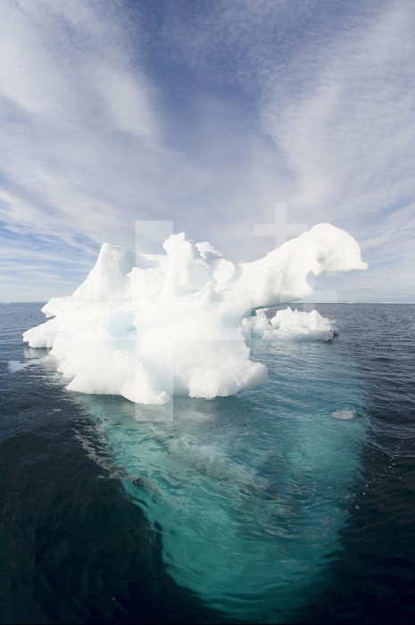 Melting Arctic Ocean ice in spring in Lancaster Sound, north west passage Nunavut, dark blue ice is usually glacial in origin and once part of much a larger iceberg.