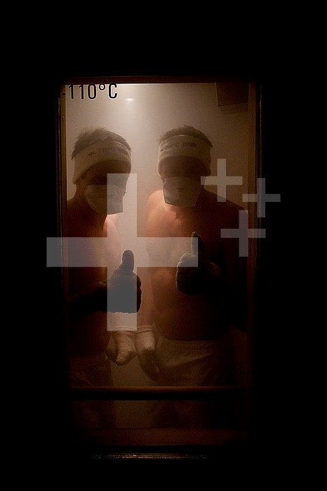 Photo essay on the Whole Body Cryotherapy at INSEP (National institute of sport) in France. Whole Body Cryotherapy is the stimulating use of extremely low temperatures below minus 110°C. The therapy stimulates the temperature receptors in the skin to communicate with the brain. The brain then transmits messages throughout the body causing the peripheral blood vessels to constrict. The enhanced blood supply that Whole Body Cryotherapy stimulates increases the oxygen and nutrient supply to areas that need revitalising. Whole Body Cryotherapy causes inhibition of inflammation which results in a reduction of pain and swelling. This reduction in pain and swelling improves joint function which enables therapists to progress treatment quicker and results in an overall sooner return to play. It helps the body recover after intense exercise by flushing out the muscles. Whole Body Cryotherapy can also be used as part of a training programme to enhance sporting performance. It increases muscular resistance to fatigue and also the muscles capacity to regenerate. This results in an overall increase in muscular performance. The processing lasts between 2 and 4 minutes.