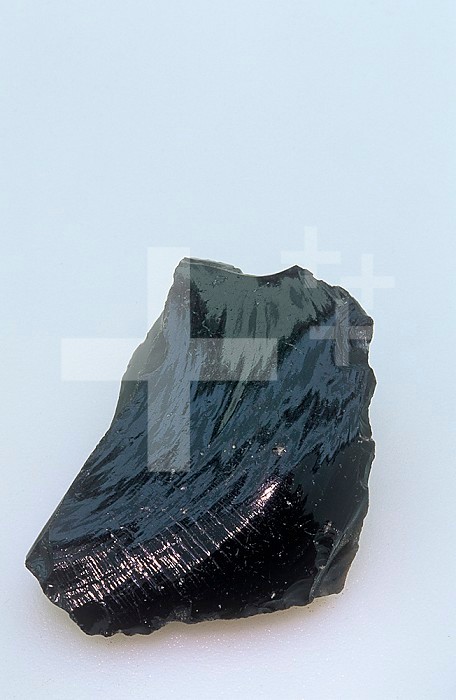 Obsidian, an glassy extrusive volcanic or igneous rock.