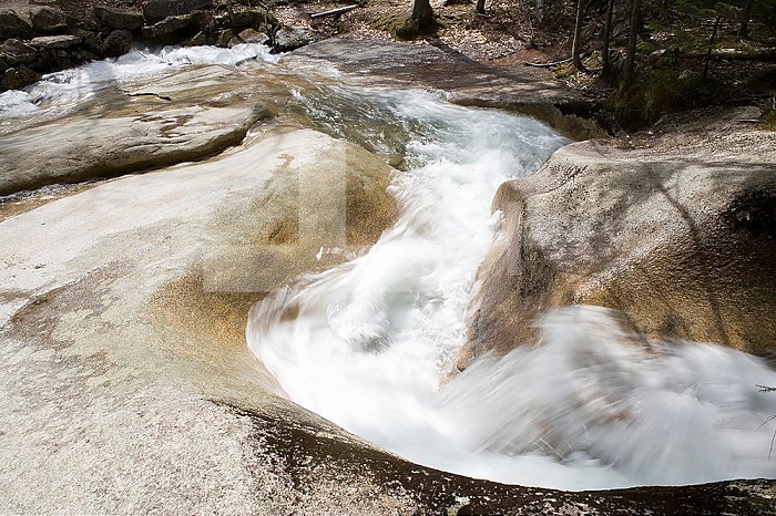 Water erosion, the Pemigewasset River eroding granite bedrock in Franconia Notch State Park, New Hampshire, USA.