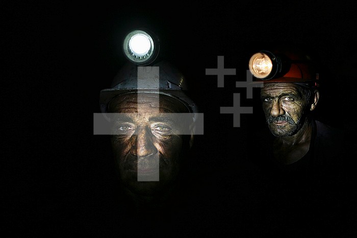 Miners in an underground coal mine in Bulgaria. Coal is used to generate electricity in power stations near the mine, providing most of the nation's electricity. Working conditions are hard and dangerous in the mines, and workers must descend up to 700 meters underground. Workers receive low wages and most die before age 50 due to lung diseases.