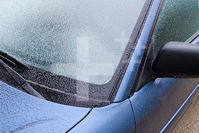 Freezing rain covers a vehicle in a layer of ice in early Spring in Colorado.