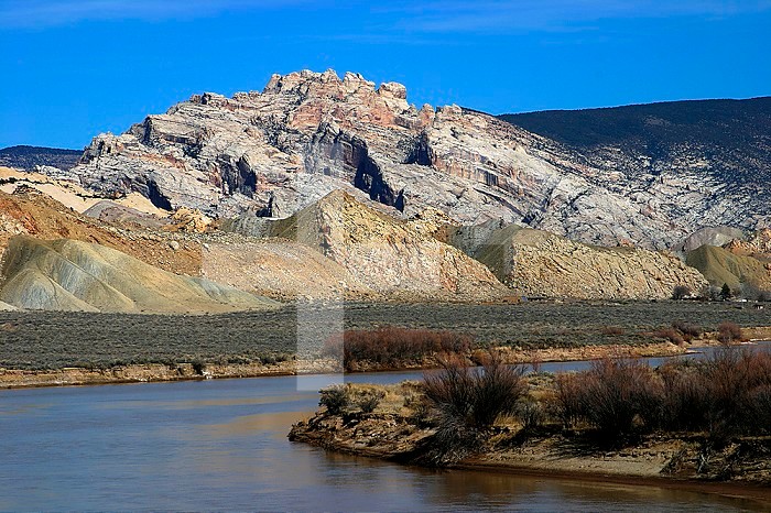 Green River and dipping sandstone sedimentary rocks. Dinosaur National Monument, Utah, USA.