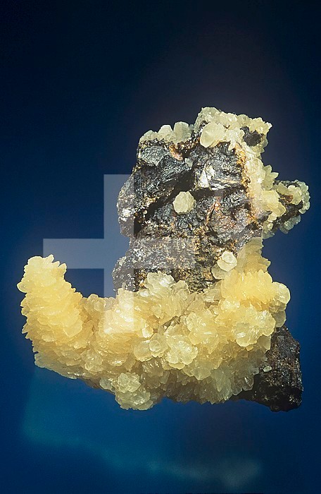 Benstonite crystals (yellow) on Sphalerite, Illinois, USA.