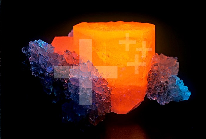 Calcite with Quartz photographed under short-wave ultraviolet (UV) light and fluorescing. Russia. (Compare with 503815)