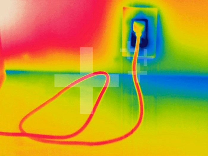 Thermogram - Electrical outlet in use - The colors show temperature variation. The temperature scale runs from white (warmest) through red, yellow, green and cyan, blue and black (coldest)