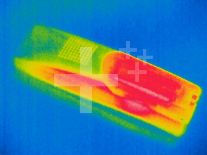 Thermogram - Portable phone - hot area is battery location - The colors show temperature variation. The temperature scale runs from white (warmest) through red, yellow, green and cyan, blue and black (coldest)