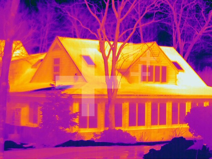 Thermogram - House on cold day - The colors show temperature variation. The temperature scale runs from white (warmest) through yellow, orange, red, purple and black (coldest)