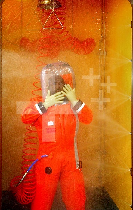In this 2007 image, Centers for Disease Control microbiologist Dr. Thomas Stevens, Jr. was showering inside a Biosafety Level 4 (BSL-4) laboratory decontamination booth, prior to exiting the sealed confines of the BSL-4 lab. The process consists of a 4 mi