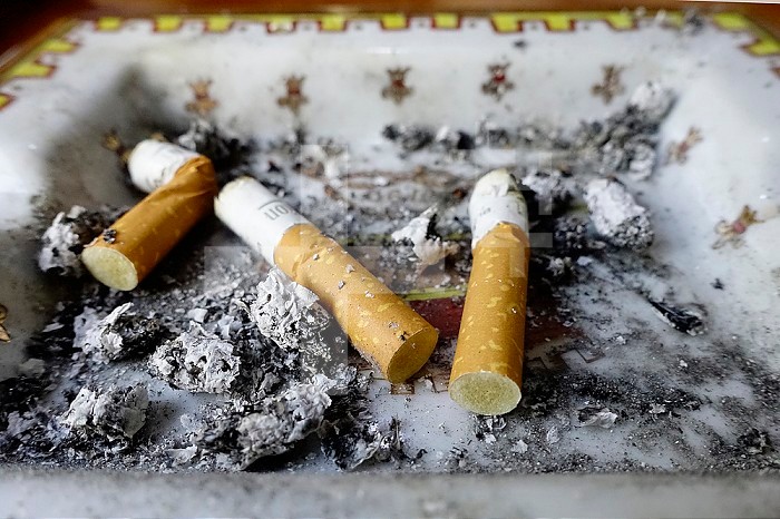 Cigarette butts in an ashtray.