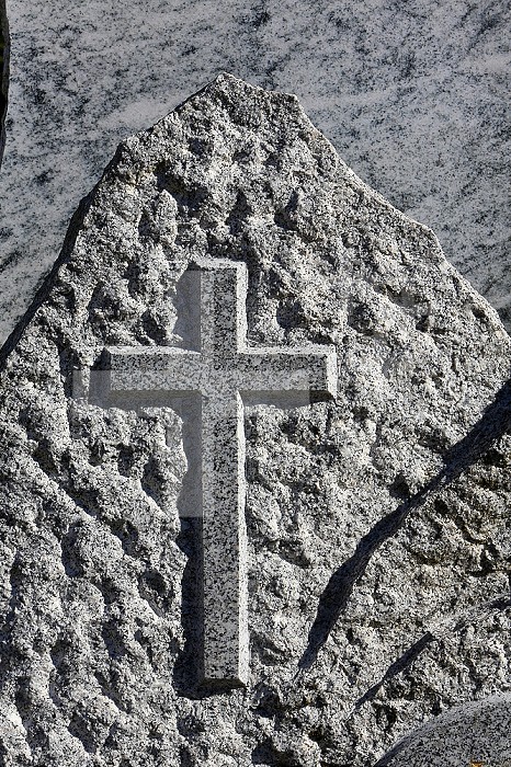 Granite cross on a tombstone-shaped mountain. Saint-Gervais-les-Bains cemetery.