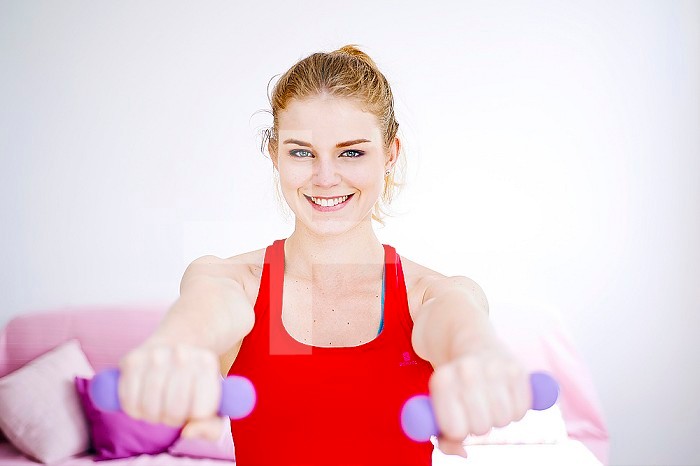 Woman practicing sport at home.