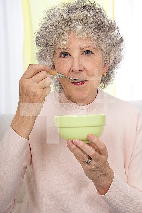 Senior woman holding a bowl.