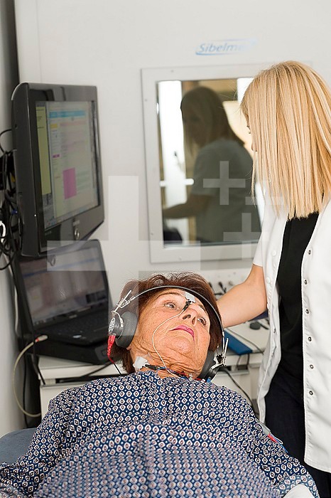 Reportage on an ENT doctor in Nice, France, treating patients suffering from dizziness. An otolithic evoked potential test. It is an electrophysiological test during which electrodes are placed on the neck to record the response of part of the inner ear (the saccules) to sound stimuli.