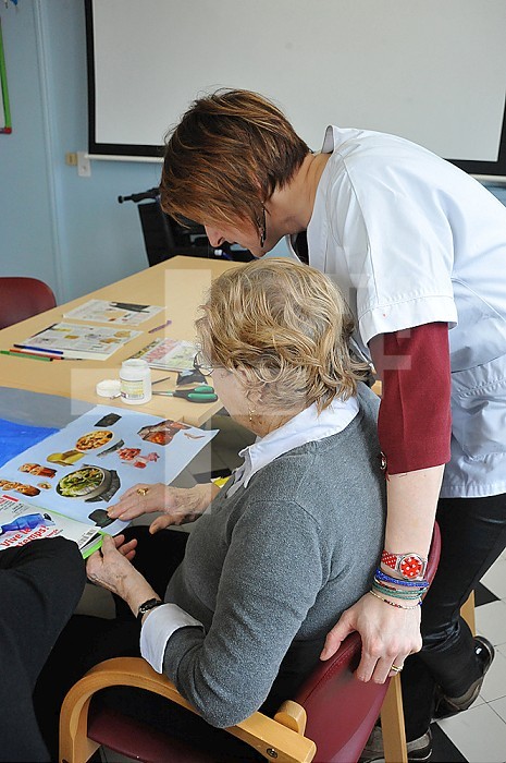 Reportage on art therapy in Ham hospital’s long-stay unit, France. Art therapy sessions are carried out in the Adapted Care and Activity Hub (Pole d’Activites et de Soins Adaptes - PASA). This hub cares for patients with behavioural disorders and provides them with an individual or group therapy activity in order to maintain or rehabilitate their motor, cognitive and sensory functions as well as social ties. The art therapist attaches great importance to self-esteem. She considers that touch, contact and considerate gestures are vital for the success of the workshops.