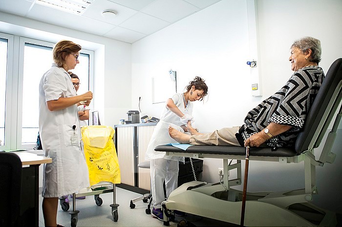 Reportage on diabetic feet consultations in a hospital in Savoie, France. These consultations are carried out by a specialized team and are devoted to treatment and after-care for diabetic patients’ foot lesions. The nurse carries out treatment.