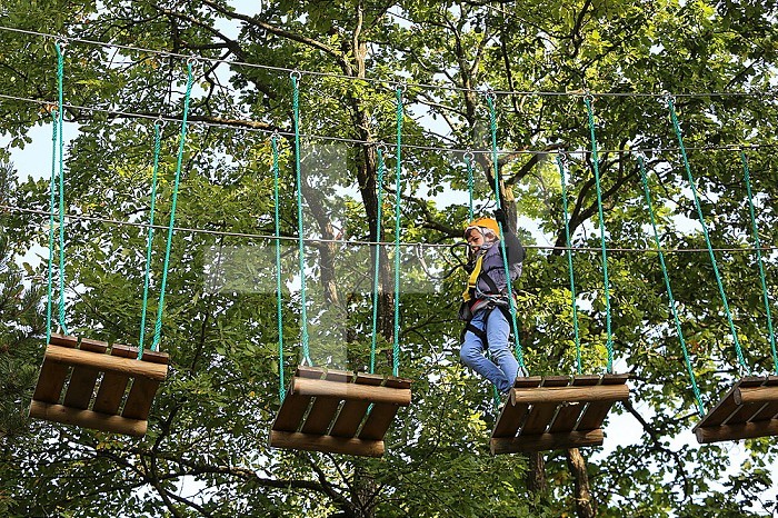 10-year-old boy on a rope course. France.